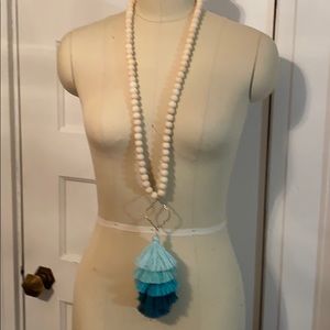 Wooden bead necklace with tiered tassle